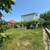 Casă spațioasă cu 2 niveluri, demisol și teren de 6 ari thumb 2
